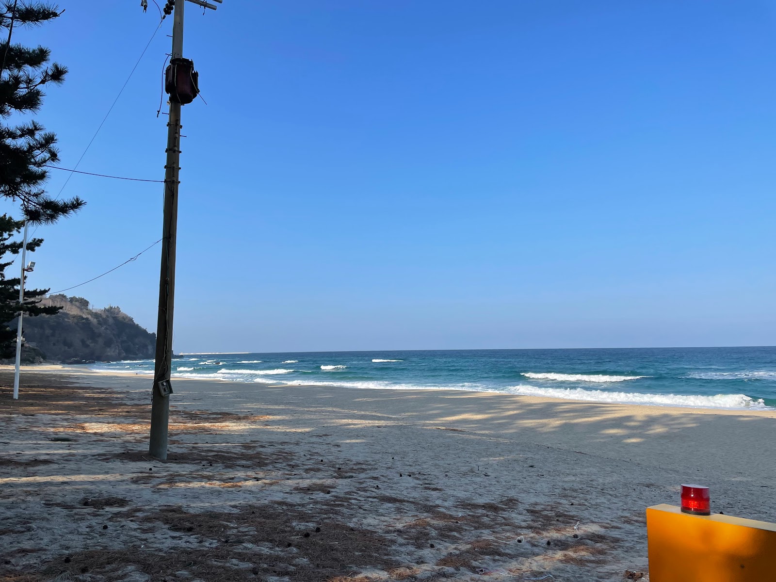 Photo of Deungmyeong Beach surrounded by mountains