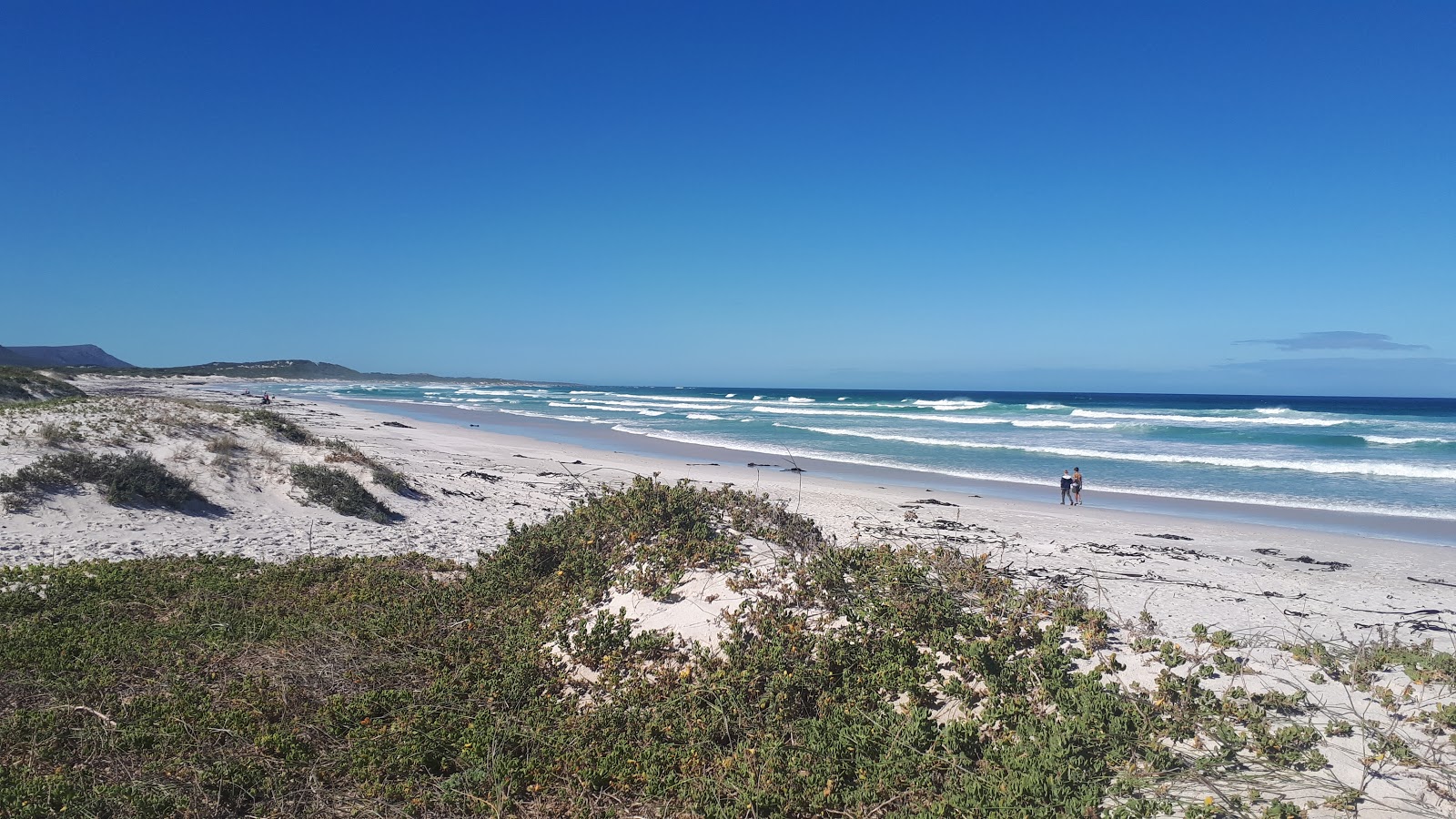 Fotografija Pearly beach z svetel fin pesek površino