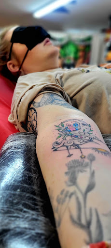 Explore wwe tattoo ideas, creative tattoo ideas in Benton, available at Spectrum Tattoo