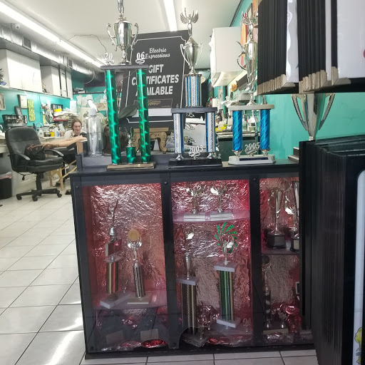 Explore mens back shoulder tattoo ideas, creative tattoo ideas in Kenner, available at Electric Expressions