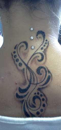 Explore forearm rose tattoo ideas, creative tattoo ideas in Summerville, available at Exotic Impressions Body Piercing