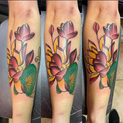 Explore blue rose tattoo ideas, creative tattoo ideas in Phenix City, available at Skin Traditions Tattoo Studio
