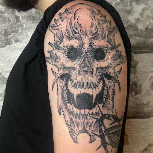 Explore flower shoulder tattoo ideas, creative tattoo ideas in Buffalo, available at True Gloom Tattoo Studio