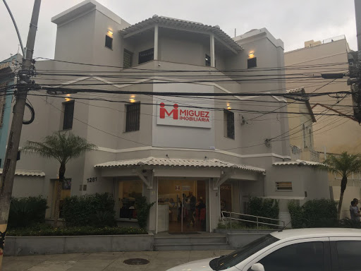 Logo da empresa - Miguez Imobiliaria - Tijuca