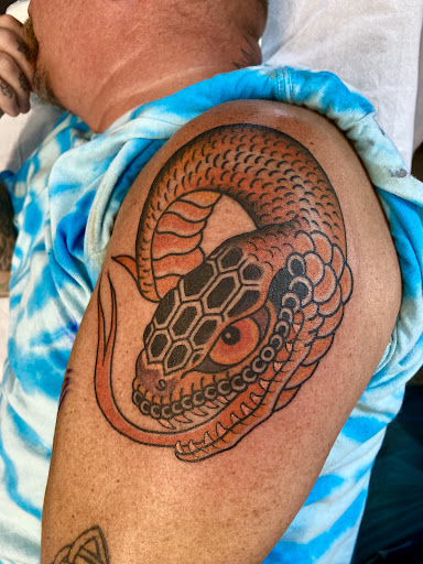 Explore adventurer tattoo ideas, creative tattoo ideas in Saint Albans, available at 100 Candles Tattoo