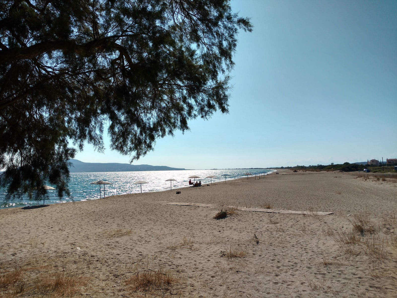 Fotografie cu Maganos beach - locul popular printre cunoscătorii de relaxare