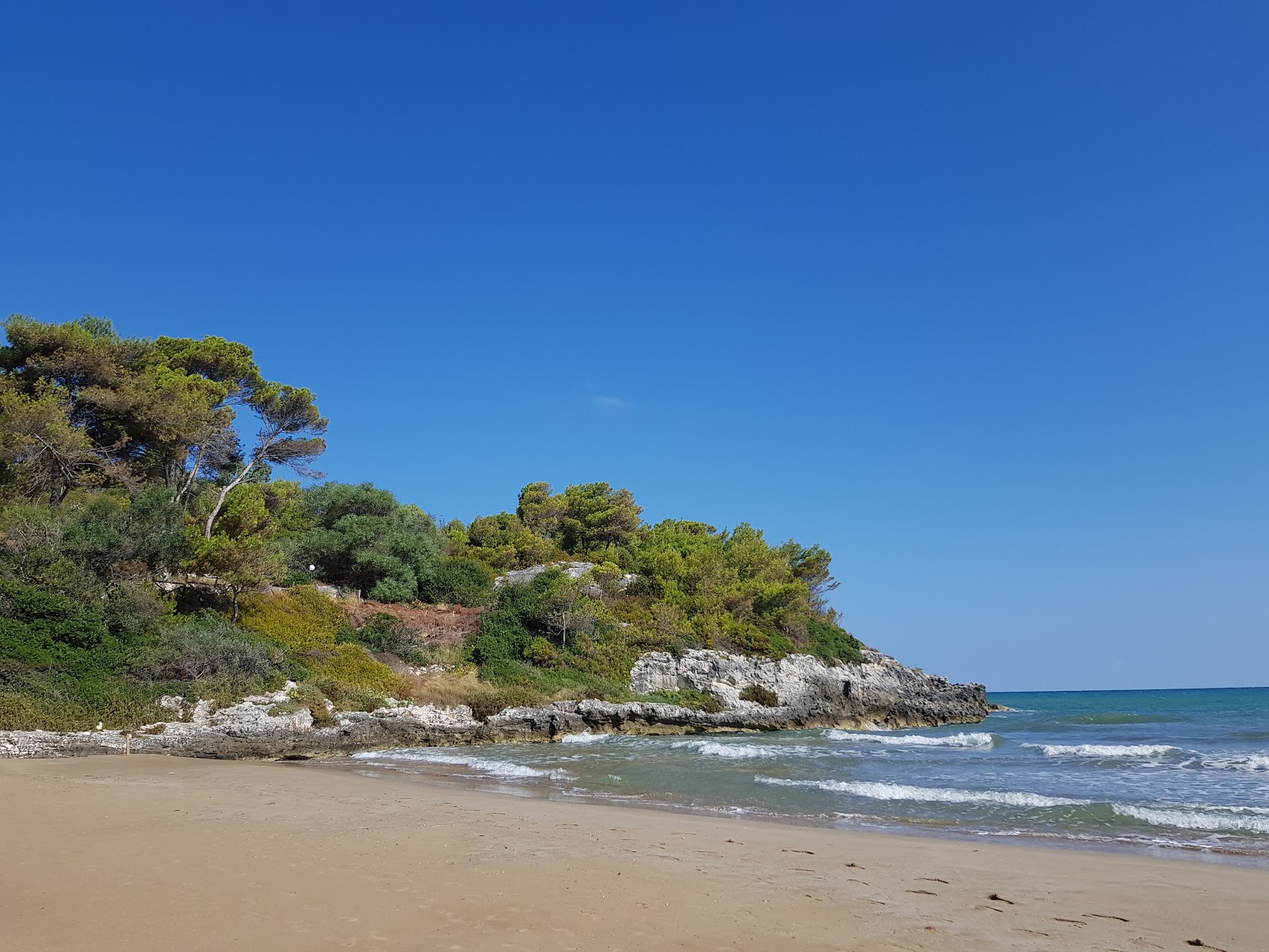 Foto van Spiaggia di Braico en de nederzetting