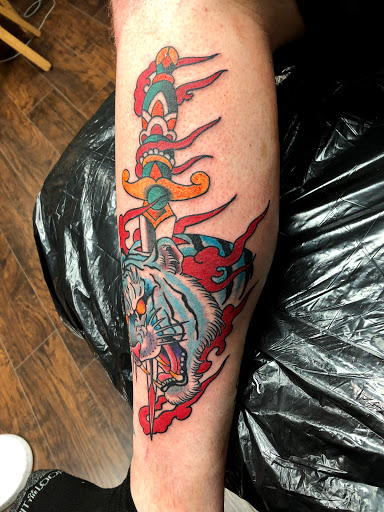 Explore back arm tattoo ideas for guys, creative tattoo ideas in Jacksonville, available at Idle Hands Tattoo Co.