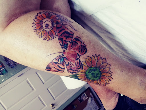 Explore back of ear tattoo ideas, creative tattoo ideas in Lakeland, available at 360 INKpressions