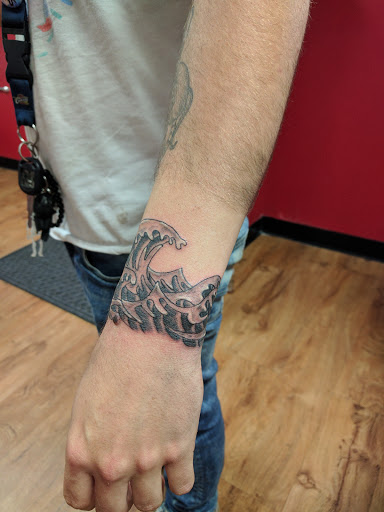 Explore dog tattoo ideas for females, creative tattoo ideas in Akron, available at Knuckle Up Ink Tattoos