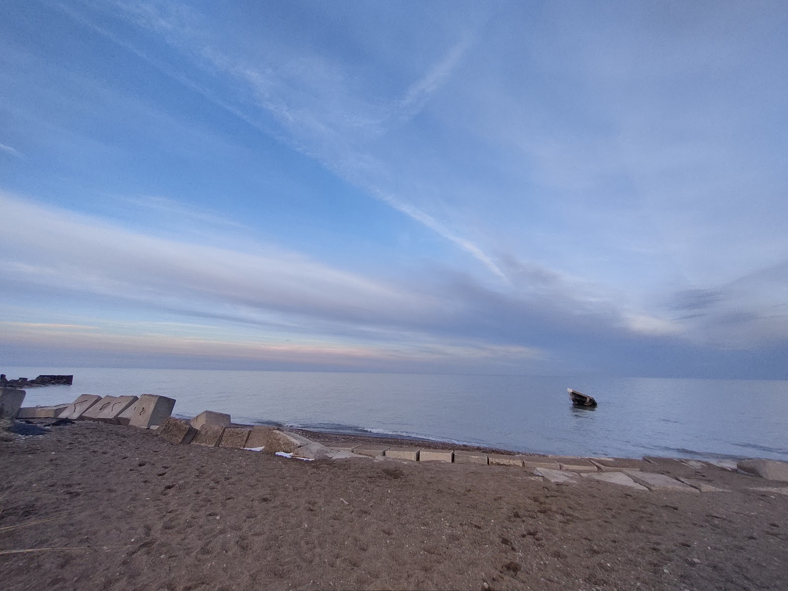 Foto di Isherwood beach - luogo popolare tra gli intenditori del relax