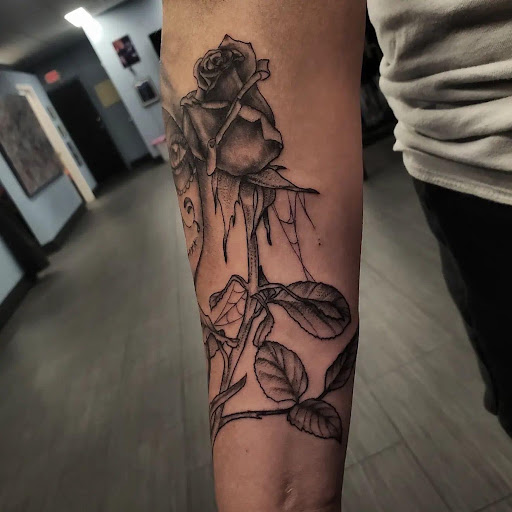 Explore cover up lower back tattoo ideas, creative tattoo ideas in Palm Harbor, available at Angry Owl Tattoo and Piercing
