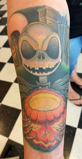 Explore hand tattoo ideas for men, creative tattoo ideas in Richmond, available at Redwoods Wild Side Tattoo