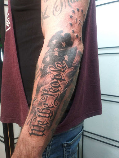 Explore growth tattoo ideas for guys, creative tattoo ideas in Decatur, available at Exclusive Ink Tattoos & Body Piercings 22nd & Wood