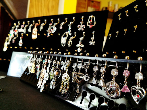 Explore behind the ear tattoo ideas, creative tattoo ideas in Jackson, available at T.R.A.P. Ink Tattoos and Piercings