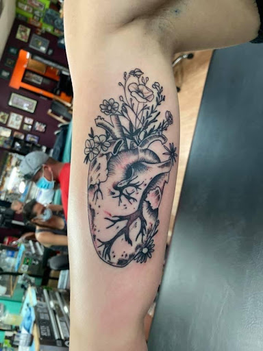 Explore side boob tattoos ideas, creative tattoo ideas in Bullhead City, available at Smoke and Dagger Tattoo