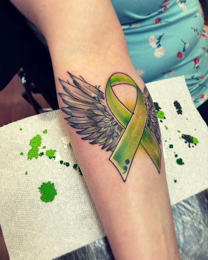 Explore kneecap tattoo ideas, creative tattoo ideas in Williamsport, available at Moa Tattoos