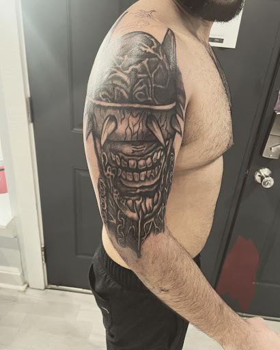 Explore half a sleeve tattoo ideas, creative tattoo ideas in Cocoa, available at Rorschach Tattoo Shop and Piercing Studio