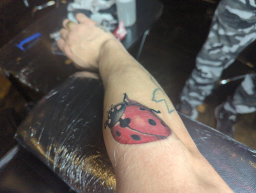 Explore chrome tattoo ideas, creative tattoo ideas in Dallas, available at Controversy Ink Tattoo Studio