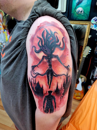 Explore iris flower tattoo ideas, creative tattoo ideas in Benton, available at Spectrum Tattoo