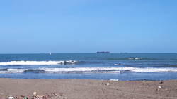 Photo de Playa Cieneguita avec rivage droit, long