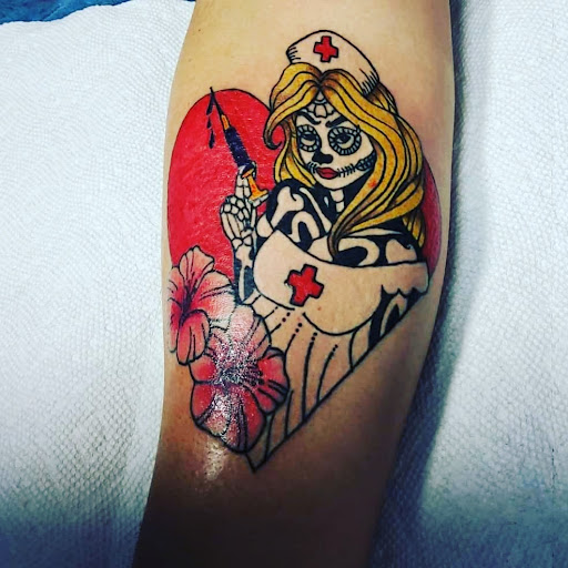 Find small tattoo between breast ideas for your next unique tattoo in Katy at Tattoo Blu