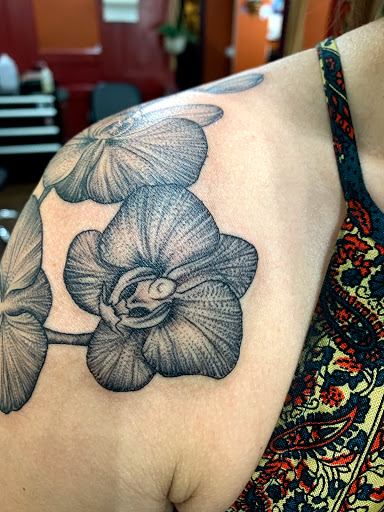 Explore cover up tattoo ideas for leg, creative tattoo ideas in Asheville, available at Spirit Alchemy Tattoo