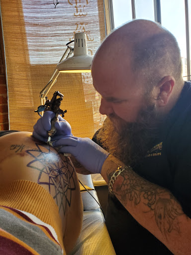 Explore middle finger tattoo ideas, creative tattoo ideas in San Diego, available at Vivid Tattoo