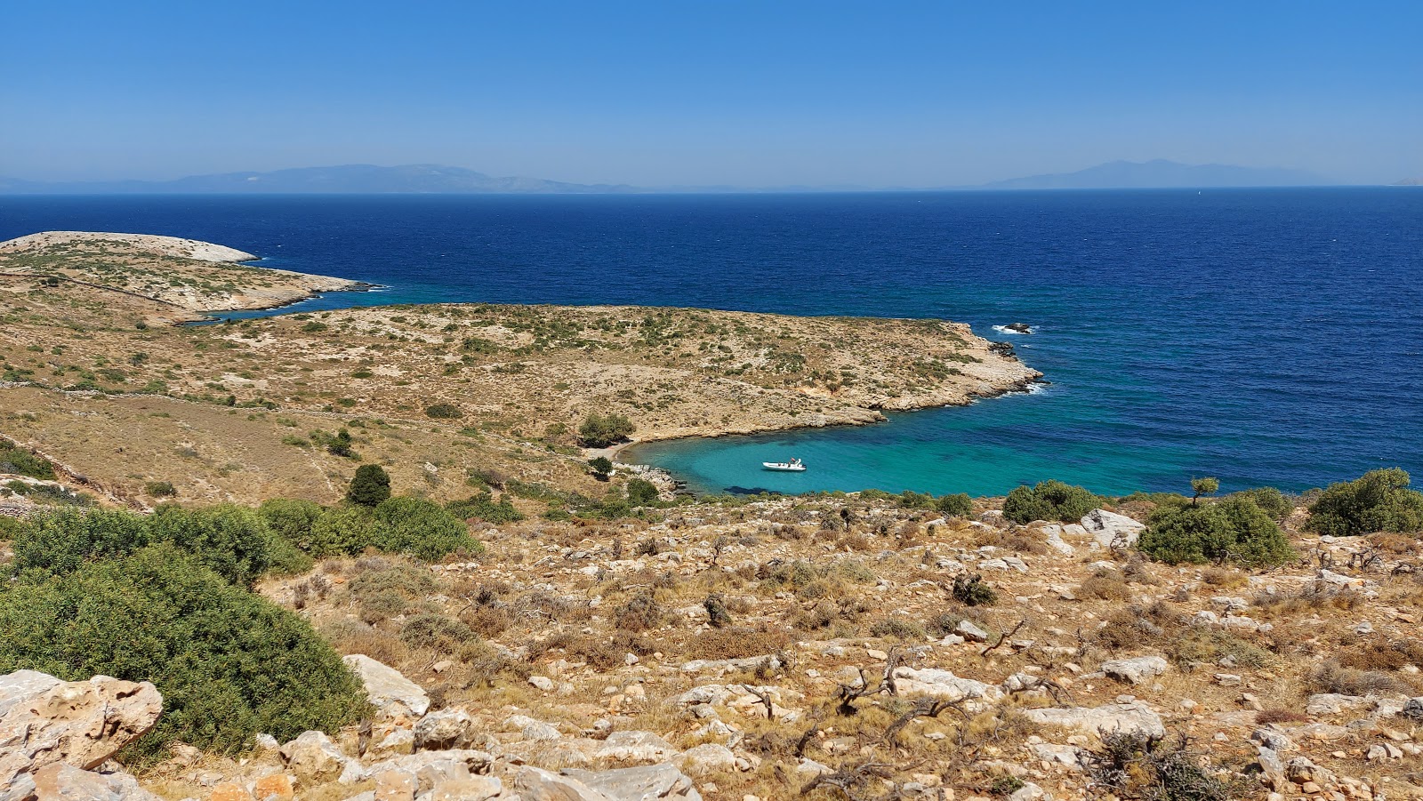 Photo of Limnari beach III with bright sand & rocks surface