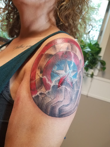 Explore seahawks tattoo ideas, creative tattoo ideas in Winona, available at Black Moth Tattoo