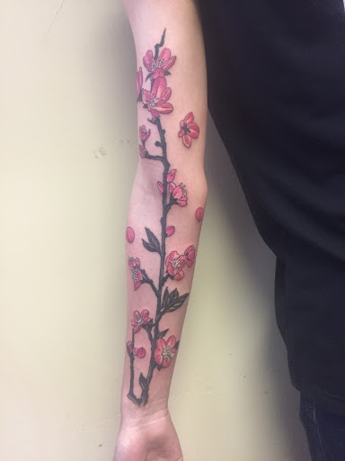 Explore unique side thigh tattoo ideas, creative tattoo ideas in Green Bay, available at Skinny Buddha Tattoo