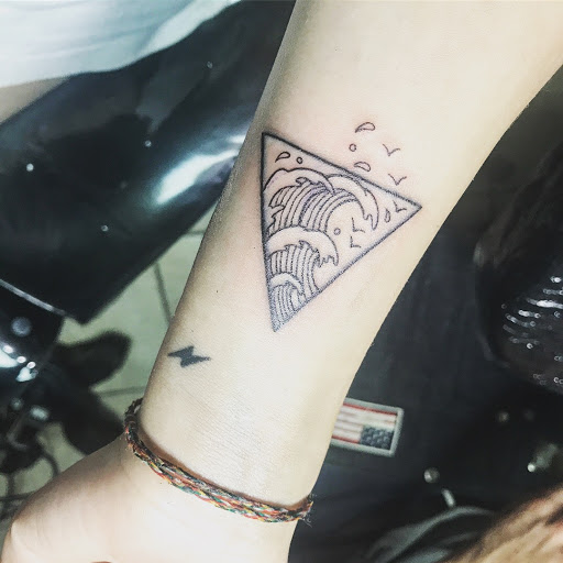 Explore hand tattoo ideas male, creative tattoo ideas in Lawrence, available at Red 5 Tattoo