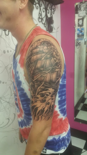 Explore broken chain tattoo ideas, creative tattoo ideas in Nicholasville, available at Castle of Color