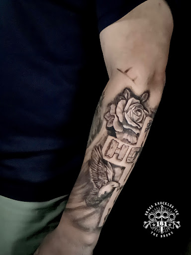Explore cover up tattoo ideas for upper arm, creative tattoo ideas in Bronx, available at Brass Knuckles Ink Tattoo Studio