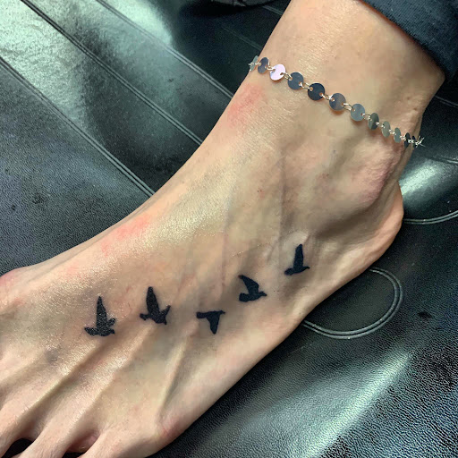 Explore wing tattoo ideas for guys, creative tattoo ideas in Hudson Falls, available at ALTERED ADDICTION TATTOOS