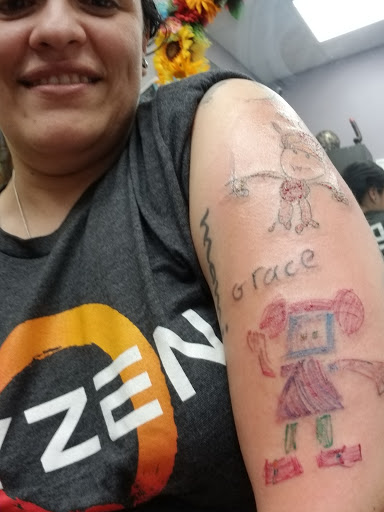 Explore feminine back tattoo ideas, creative tattoo ideas in Springfield, available at InkI.Adore