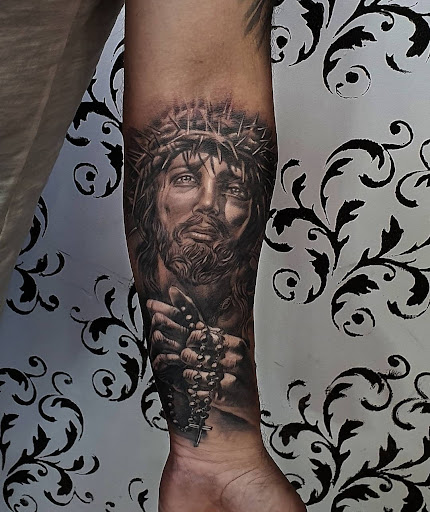 Explore religious cross tattoo ideas, creative tattoo ideas in Ambler, available at Tattoo GalaxyAmbler Piercing & Custom Tattoos