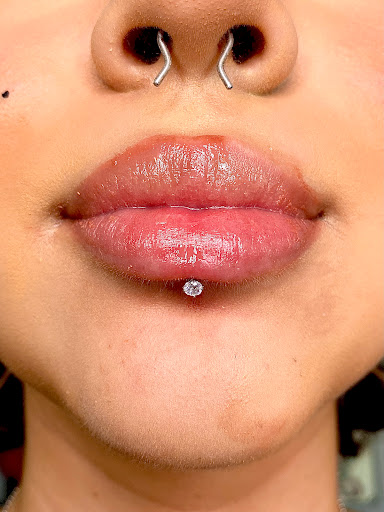 Explore childhood tattoo ideas, creative tattoo ideas in Orange, available at Symbiosis Body Piercing