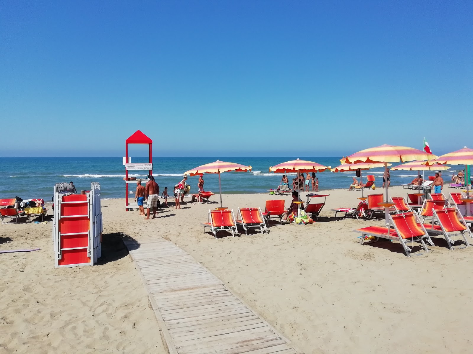 Fotografija Lupetta beach z rjavi pesek površino