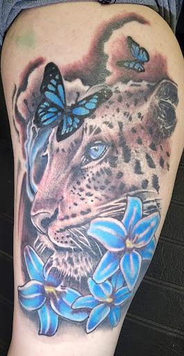 Explore mens tattoo ideas leg, creative tattoo ideas in Angola, available at Hoodlum Ink