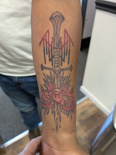 Explore wrap tattoo ideas, creative tattoo ideas in Cornelia, available at Prismatic Pulse Tattoo