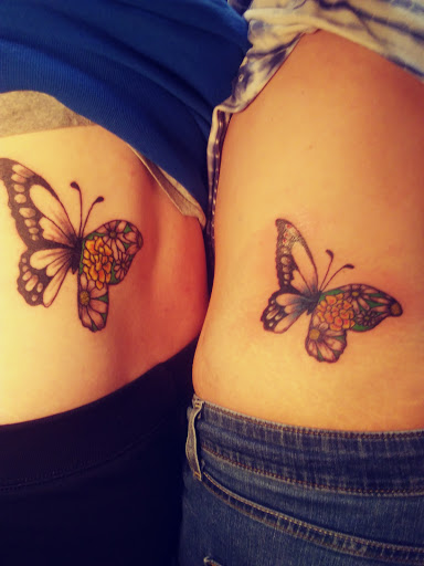 Explore rose and butterfly tattoo ideas, creative tattoo ideas in Reedsville, available at Rock Shop Tattoos