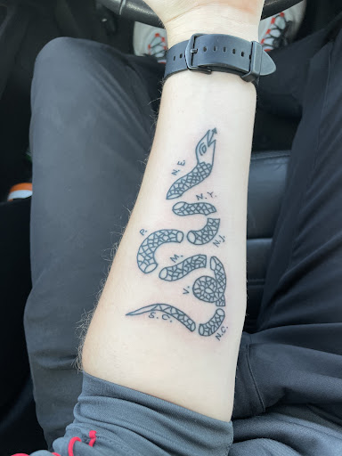 Explore torn skin tattoo ideas, creative tattoo ideas in Cedar Falls, available at Omega Red Piercing & Tattoo