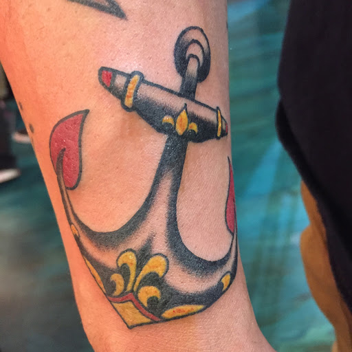 Explore snail tattoo ideas, creative tattoo ideas in Reno, available at Aces Tattoo