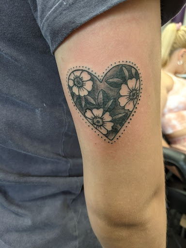 Explore highland cow tattoo ideas, creative tattoo ideas in Slippery Rock, available at Dinky Dachshund Tattoo Parlor
