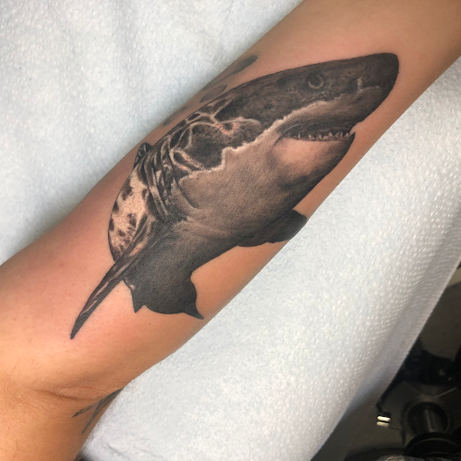 Explore front neck tattoo ideas, creative tattoo ideas in Englewood, available at Point of Entry Tattoo