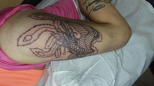 Explore men's skull tattoo ideas, creative tattoo ideas in Jessup, available at Savage Ink Tattoo Studio