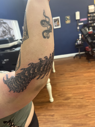 Explore latin phrases tattoo ideas, creative tattoo ideas in Cocoa, available at Rorschach Tattoo Shop and Piercing Studio