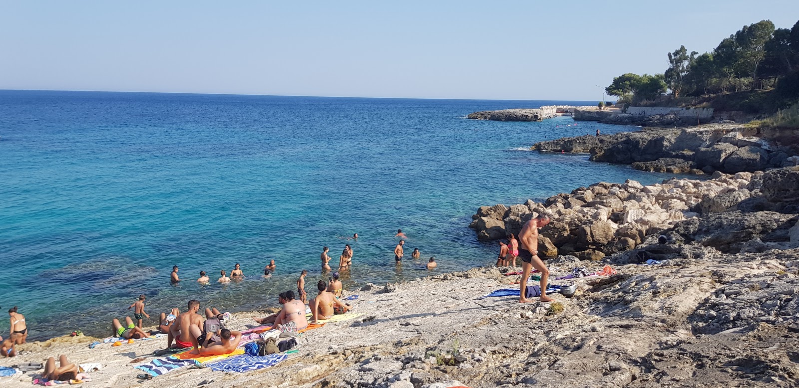 Fotografie cu Spiaggia di Chianca Liscia cu o suprafață de apă pură albastră