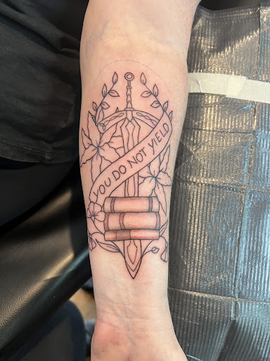Explore fishing hook tattoo ideas, creative tattoo ideas in North Conway, available at The Darling Grey Tattoo,Gallery & Piercing